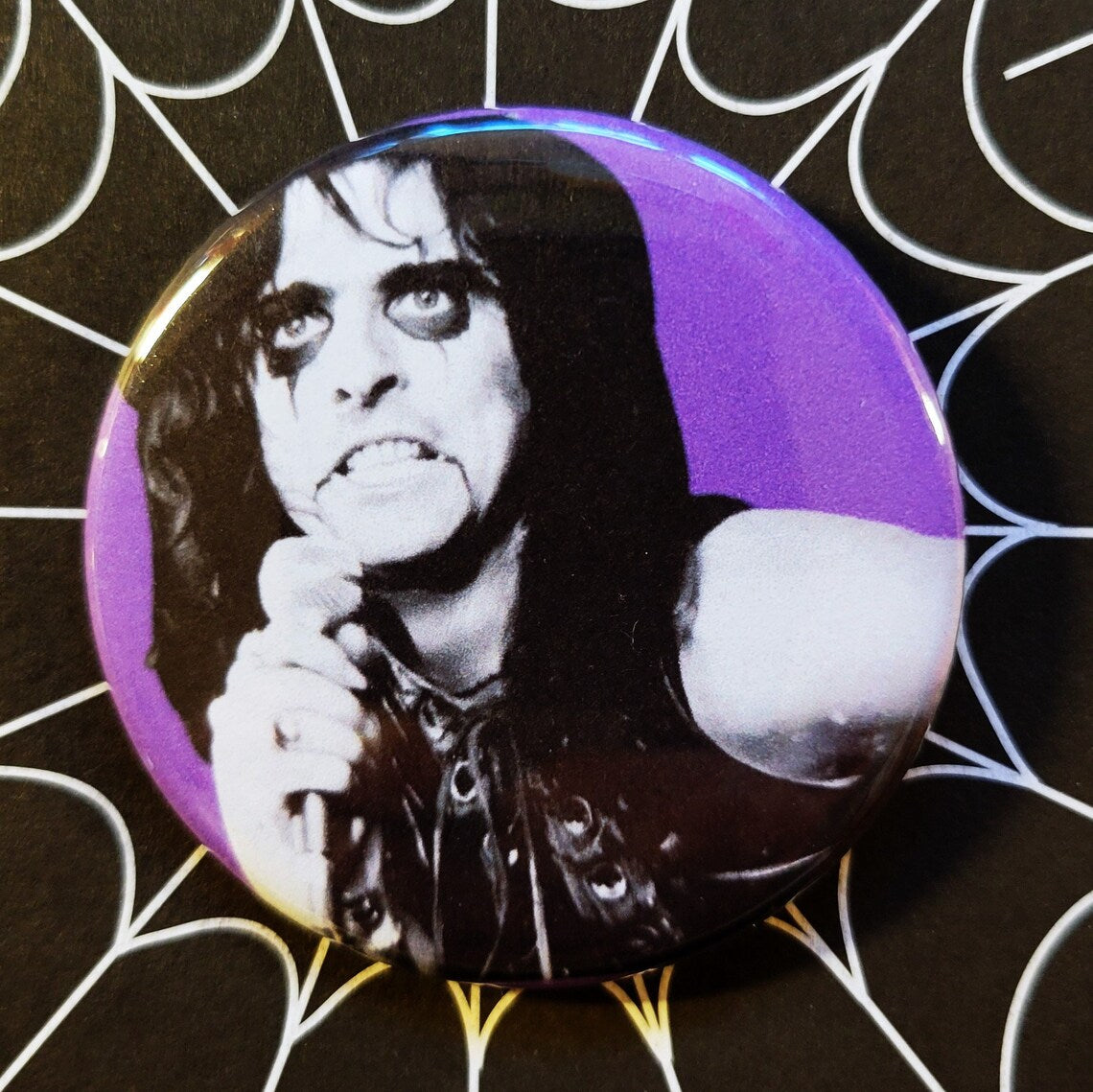 Alice Cooper pinback Buttons and Bottle Openers.